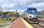 Running 1.75 hours late, Amtrak Silver Meteor Train # 97 glides into the park setting depot of Winter Park, Florida behind two P42DCs